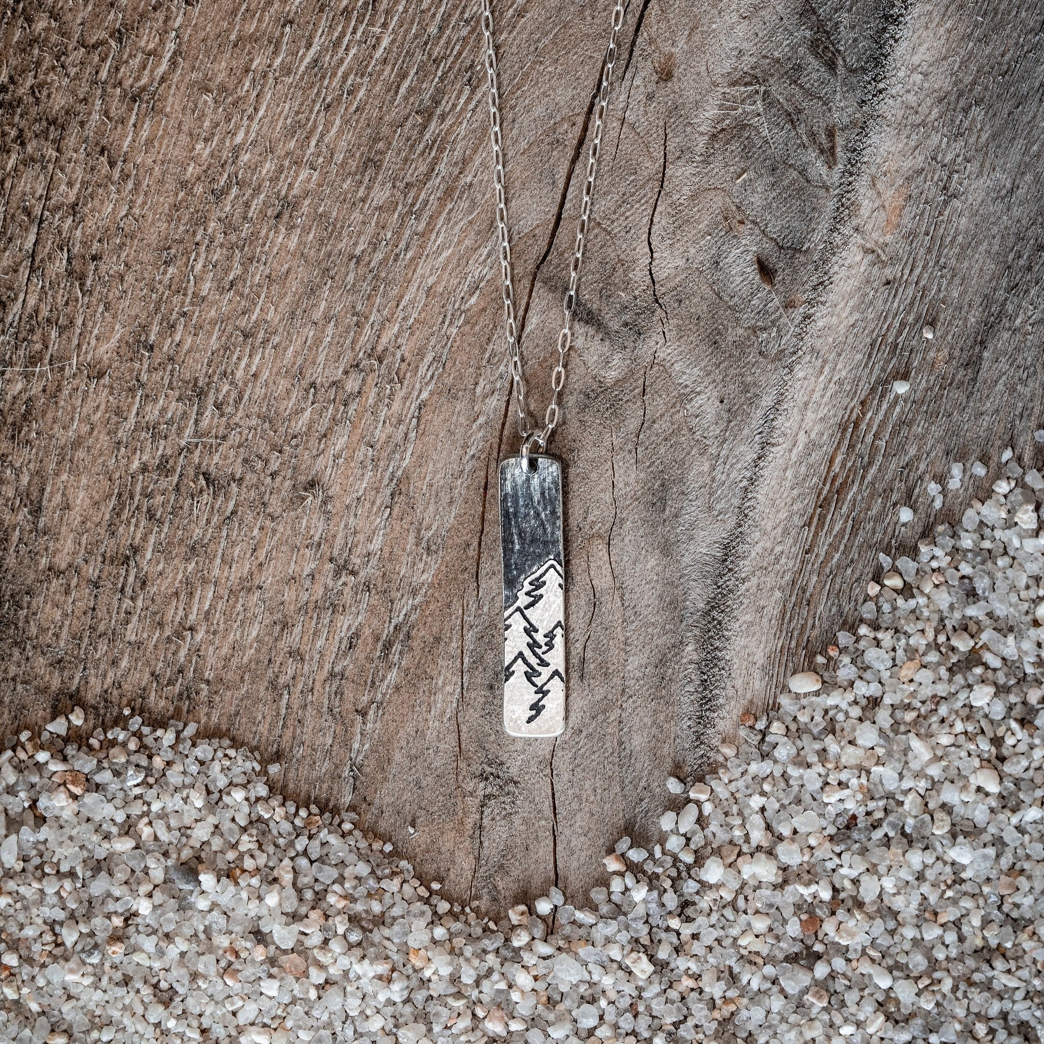 Solid Sterling Silver pendant. Polished finish on the front. Satin finish on the back. Solid Sterling Silver chain.