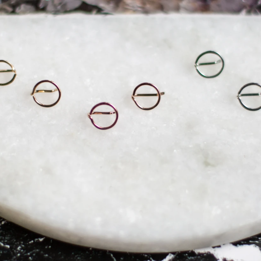 A variation on our best selling bobby pin earring, this simple circle is a fun and easy to wear option. it's not a post, but more like a cuff for your pierced lobe. Sleep in it, take phone calls, give tight hugs… this amazing earring will never poke or jab like post earrings can.