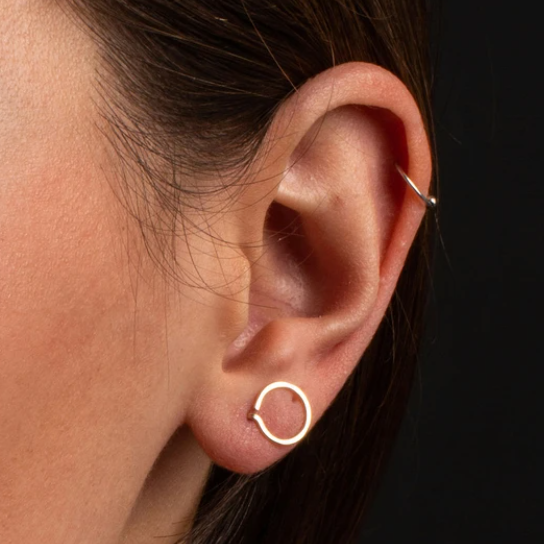 A variation on our best selling bobby pin earring, this simple circle is a fun and easy to wear option. it's not a post, but more like a cuff for your pierced lobe. Sleep in it, take phone calls, give tight hugs… this amazing earring will never poke or jab like post earrings can.