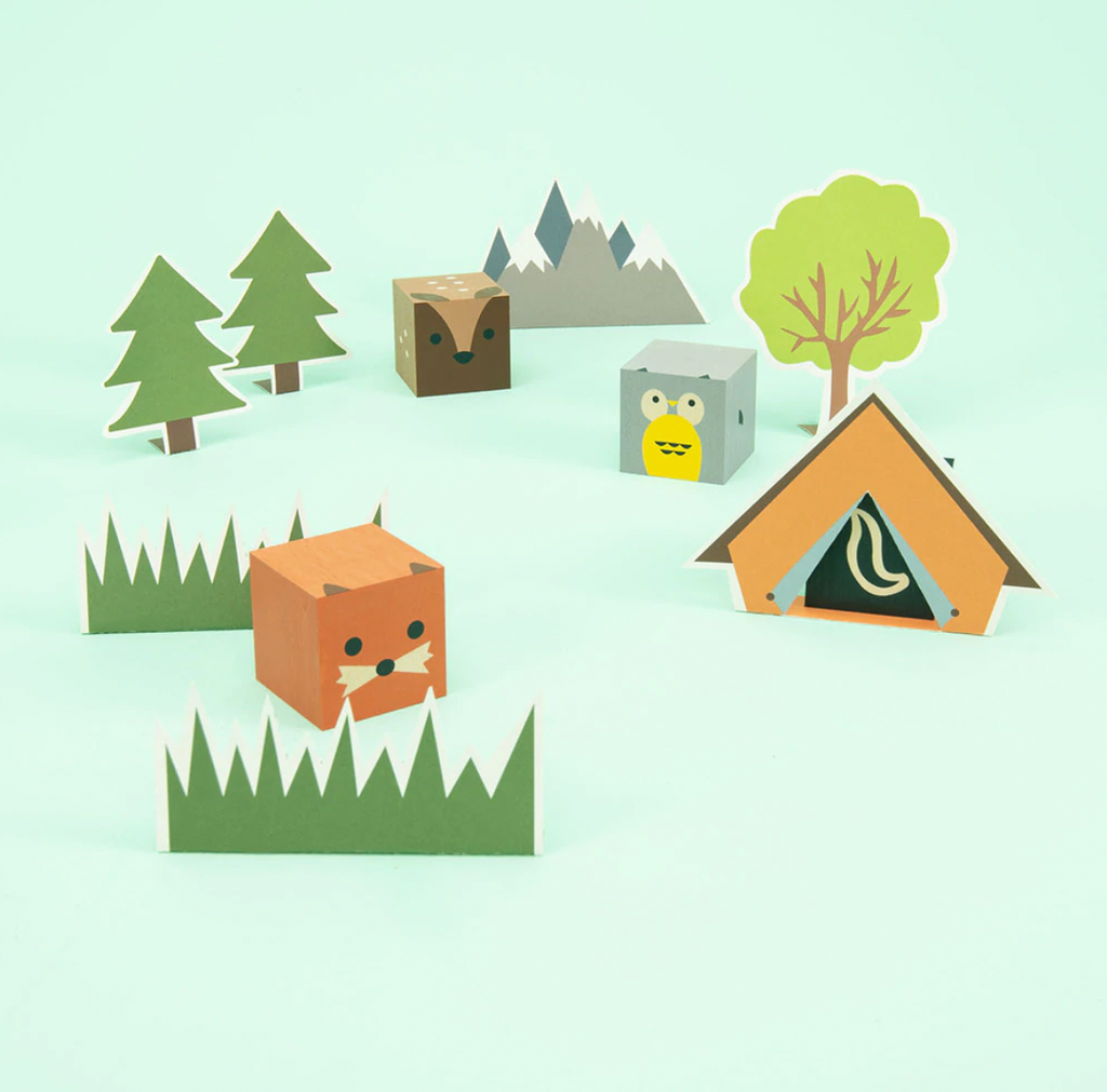 Owl. Skunk. Deer. Fox. Your favorite forest animals, squared.  Made from sustainable Midwestern basswood. You’ll also find four paper environments. Eco-friendly fun.  Mix, match, hoot.  4 - 1.75 inch cubes