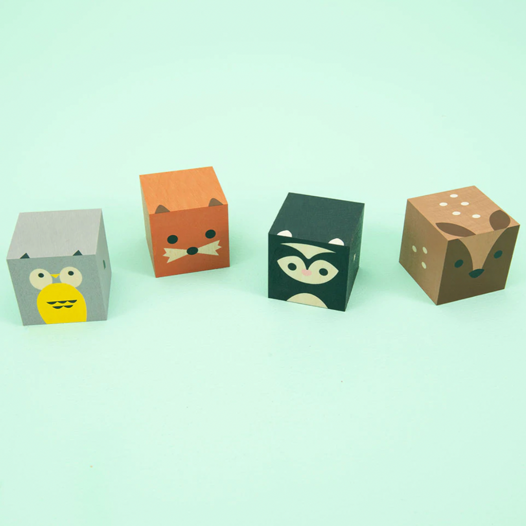 Owl. Skunk. Deer. Fox. Your favorite forest animals, squared.  Made from sustainable Midwestern basswood. You’ll also find four paper environments. Eco-friendly fun.  Mix, match, hoot.  4 - 1.75 inch cubes