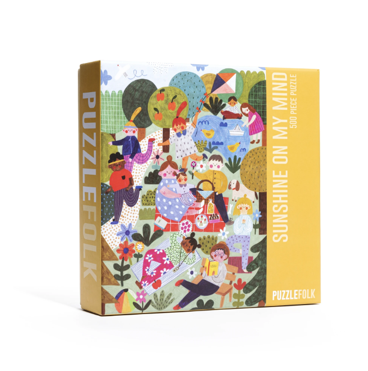 A fun, bright puzzle featuring friends and families enjoying the afternoon sunshine in the park! We hope you love this puzzle to pieces!  500 piece puzzle  Finished puzzle dimensions - 16.5" x 22.5"