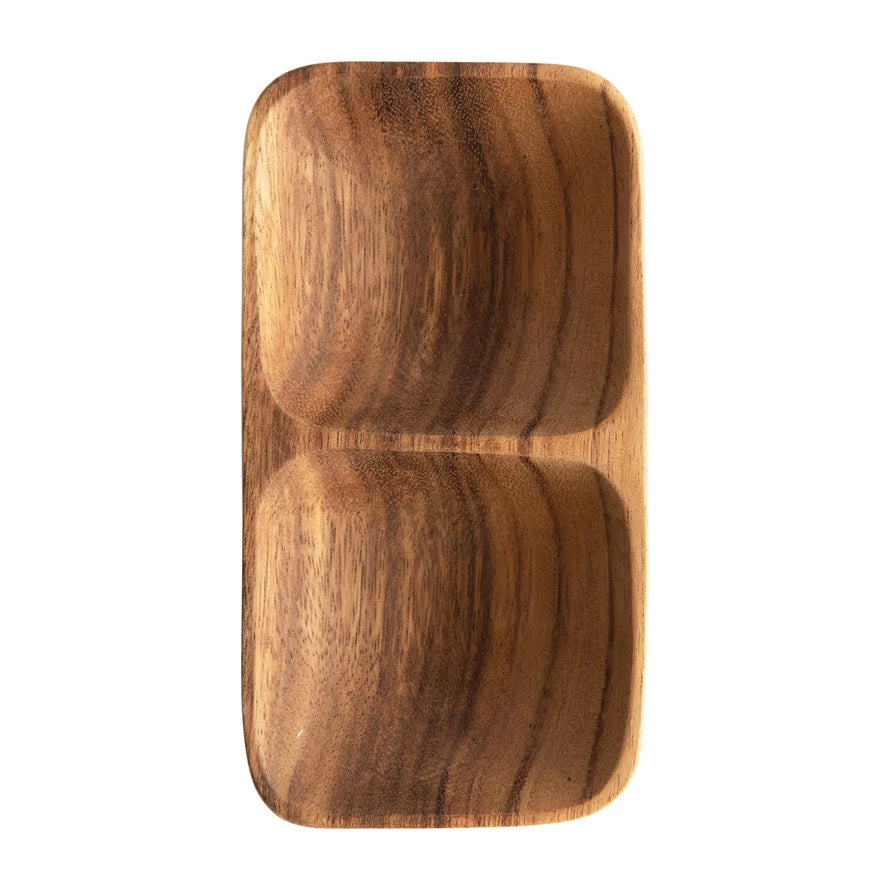 This wood tray is perfect for serving foods to friends or family, or simply set on a table with small decorative accents for display. Made out of acacia wood, this tray has 2 compartments for serving different foods. Pull this out at your next gathering and serve your guests in style     Dimensions  6-1/2"L x 3-3/4"W x 1-1/4"H