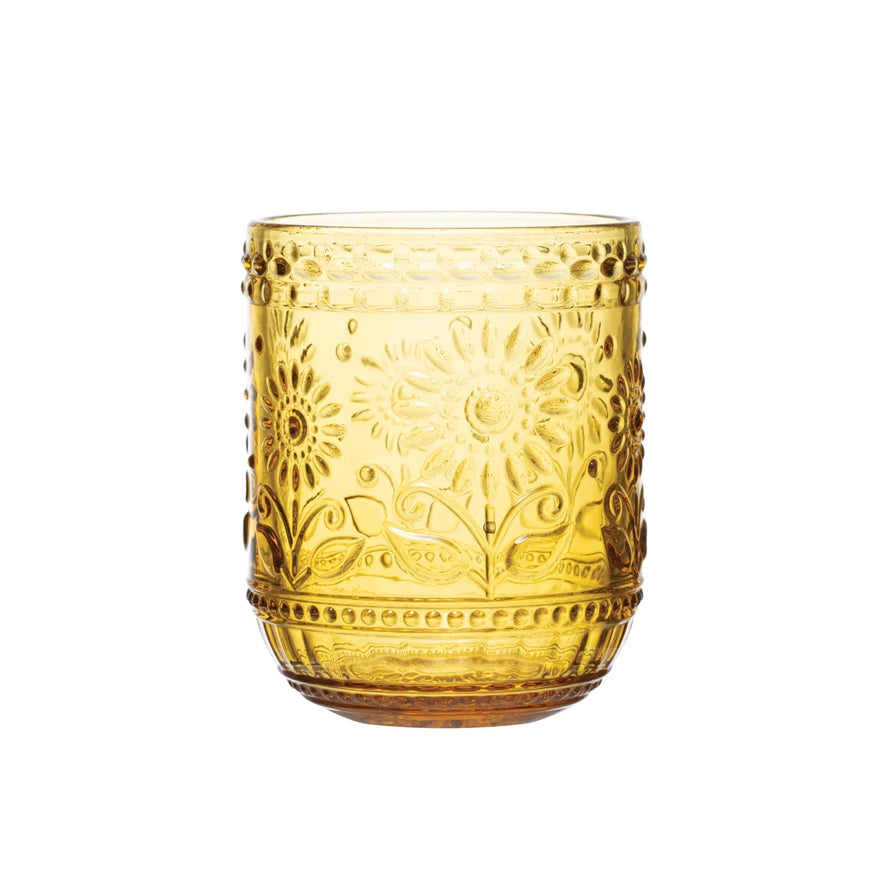 This drinking glass brings both style and class to any gathering. With beautiful detailing, this embossed glass features a bold amber color that effortlessly catches the eye. Whether for enjoying a nice cocktail with friends, or as a glass for a meal with family, this stylish glass is a must-have     *THIS ITEM IS PICK UP ONLY*     Color  Amber      Size   3-1/4" Round x 4"H 12 oz.