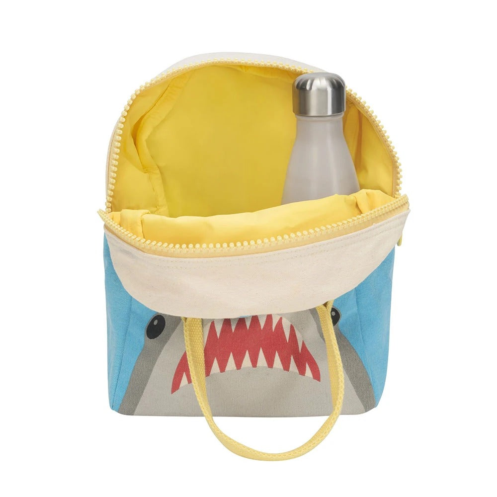 Certified organic cotton. Preshrunk and fully machine washable. Cotton canvas carry handles. Zipper closure. Rinse-able, tested food-safe lining. Interior pocket (for a water bottle or ice pack). Durable and roomy. Lunch bag is lined but not insulated. Water-resistant lining works well with an ice pack, if desired. Shark pattern.