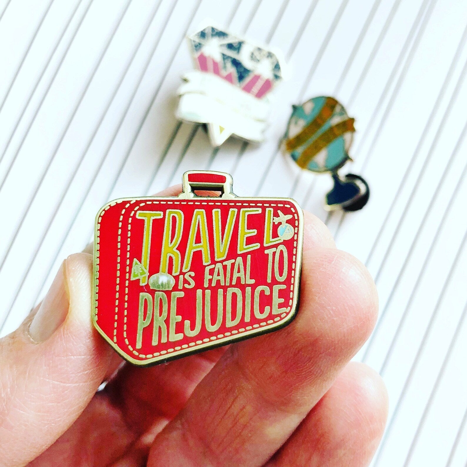 Travel is Fatal to Prejudice Enamel Pins
