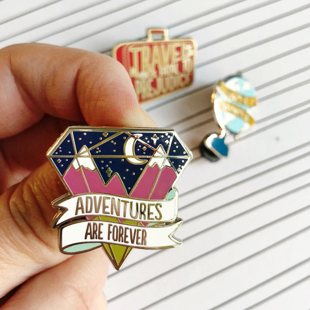Adventures are Forever Enamel Pin. Pink mountains, crescent moon, starry sky.