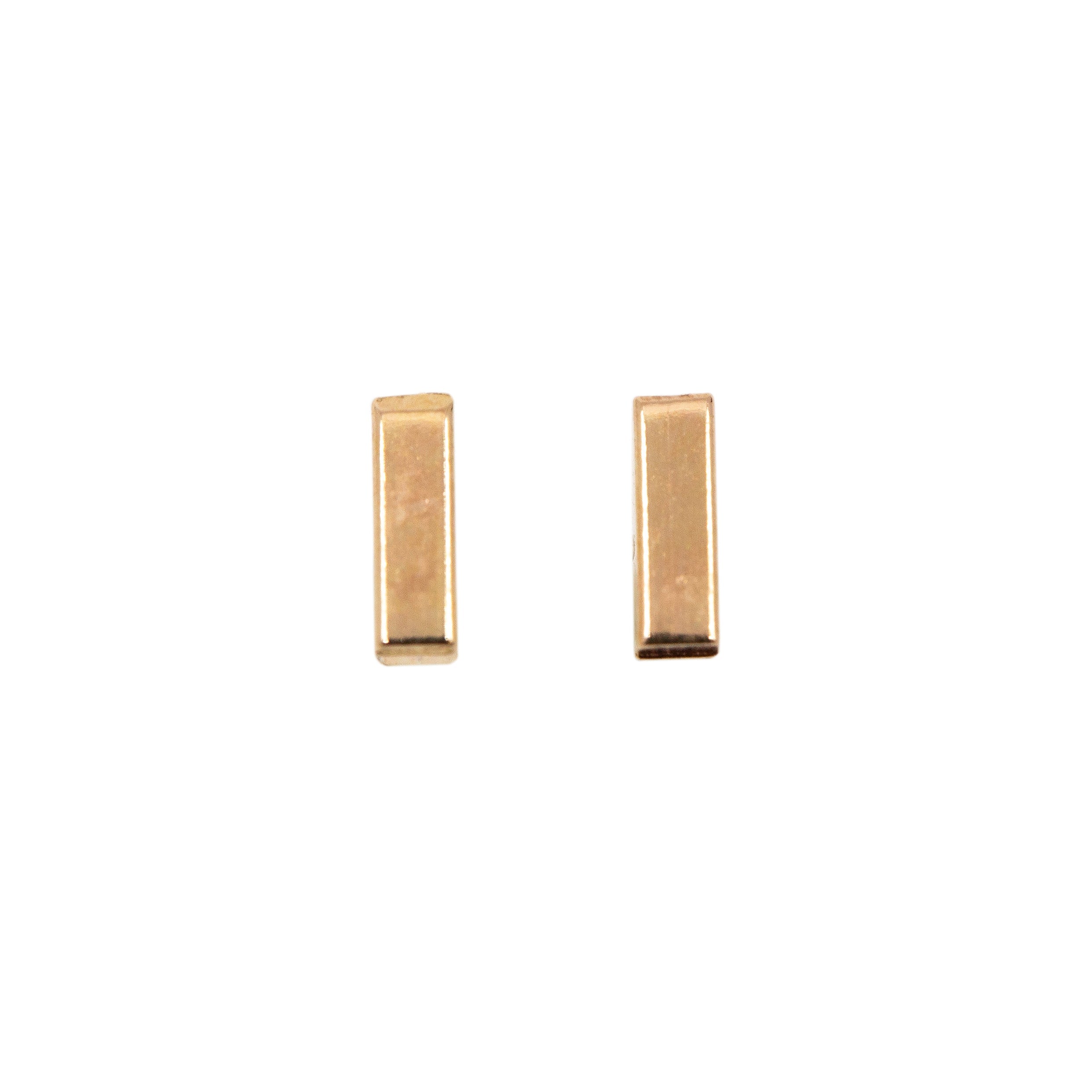 The perfect piece for everyday wear in the perfect mini size! 14k goldfill bar or sterling silver bar with a smooth finish soldered to sterling silver ear posts.

Measures 5mm in length